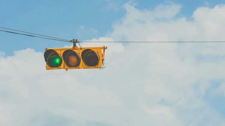 Traffic light with sky background