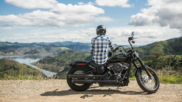 Motorcycle rider, male, parked sitting with a view